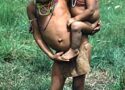 Yequana child carrying baby